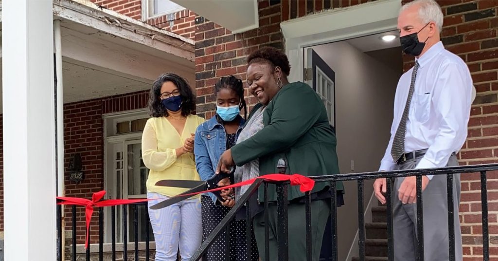 Tiffany Green cuts the ribbon on her first project in Liberty Square