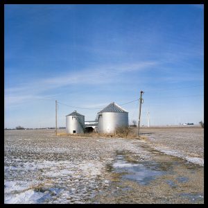 Photograph of a silo in a snowy Illinois field