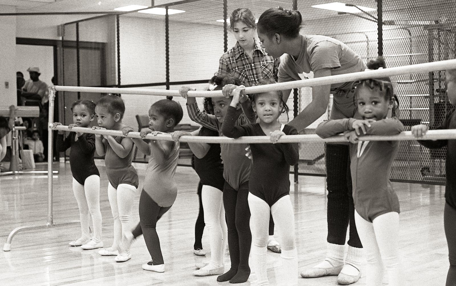 Young dancers at the Barre with instructors