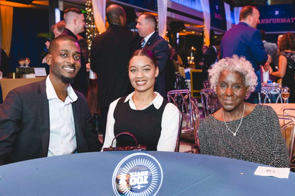 Ty Hobson-Powell, B.A. ’11, with guest Virginia Hill and Debra L. Roberts