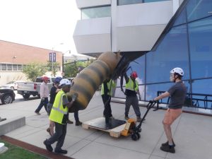 Workers installing Bee Sculpture
