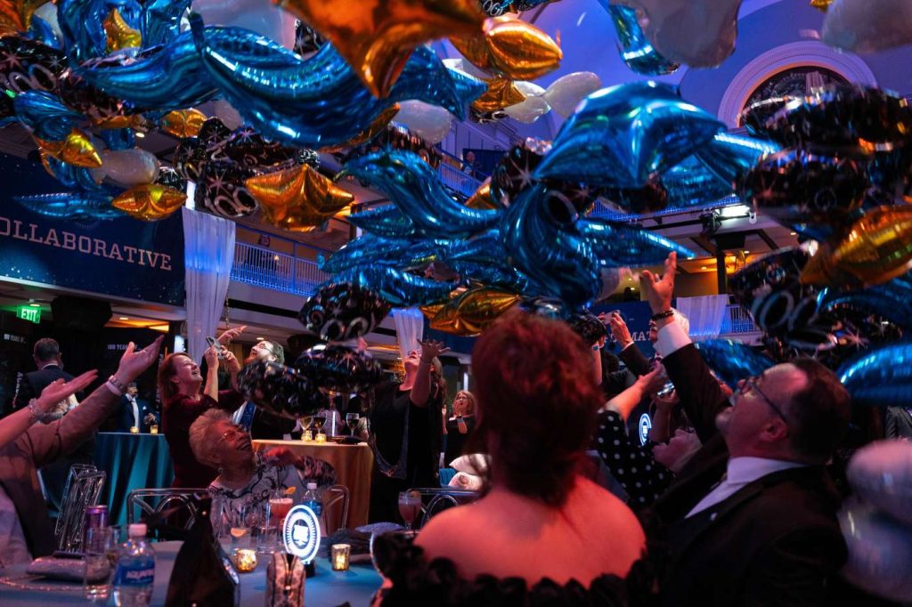 Partygoers looking upward